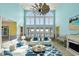 Bright living room with stunning ocean views, modern decor, comfortable seating, and beachy accents at 2201 S Waccamaw Dr., Murrells Inlet, SC 29576