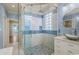 Modern shower with glass door and custom tile work at 2201 S Waccamaw Dr., Murrells Inlet, SC 29576