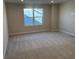 Bright bedroom with neutral carpeting and a large window providing natural light at 2317 Hazel Way, Longs, SC 29568