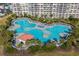 An expansive outdoor pool area offers generous lounge space, mature palms, and comfortable seating around a central pavilion at 2323 Tidewatch Way, North Myrtle Beach, SC 29582