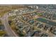 Aerial view of home, community, and pond in a neighborhood near the ocean at 2323 Tidewatch Way, North Myrtle Beach, SC 29582