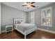 Comfortable bedroom with hardwood floors, plantation shutters and a ceiling fan at 2323 Tidewatch Way, North Myrtle Beach, SC 29582