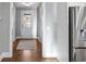 Home entryway with hardwood floors, a light gray rug, and a view of the front door at 2323 Tidewatch Way, North Myrtle Beach, SC 29582