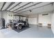 Spacious garage with epoxy floors, built in storage, and golf cart parked inside at 2323 Tidewatch Way, North Myrtle Beach, SC 29582