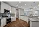 Beautiful kitchen with white cabinetry, stainless steel appliances, and granite countertops at 2323 Tidewatch Way, North Myrtle Beach, SC 29582