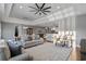Spacious living room featuring hardwood floors, tray ceiling, and an open concept design at 2323 Tidewatch Way, North Myrtle Beach, SC 29582