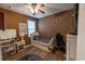 A cute bedroom with a white bed frame, wood floors, natural light, and gold polka dot accent wall at 244 Legends Village Loop, Myrtle Beach, SC 29579