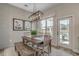Charming dining room featuring a rustic table, modern lighting, and shiplap wall detail, complemented by natural light at 2520 Brescia St., Myrtle Beach, SC 29579