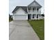 Charming two-story home featuring a welcoming front porch, a two car garage and manicured lawn at 2520 Brescia St., Myrtle Beach, SC 29579