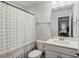 Clean bathroom featuring a white vanity, toilet, and a shower with patterned curtain at 2652 Ellesmere Circle, Myrtle Beach, SC 29579