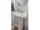 Classic bathroom showcasing a pedestal sink, modern faucet, and round mirror at 2652 Ellesmere Circle, Myrtle Beach, SC 29579