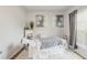 Bright bedroom with a bed, white walls, and decorative artwork at 2652 Ellesmere Circle, Myrtle Beach, SC 29579