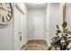 Entryway with wood-look floors, white walls, coat closet and decorative accents at 2652 Ellesmere Circle, Myrtle Beach, SC 29579