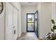 Bright foyer featuring wood flooring, closet, and view of the front yard through the door at 2652 Ellesmere Circle, Myrtle Beach, SC 29579