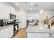 Well-equipped kitchen with a center island, modern appliances and plentiful storage at 2652 Ellesmere Circle, Myrtle Beach, SC 29579