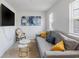 Comfortable living room featuring a gray sofa, accent chairs, and modern artwork at 2652 Ellesmere Circle, Myrtle Beach, SC 29579