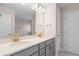 A bathroom showcasing double sinks with modern fixtures and a large mirror at 308 Starlit Way, Myrtle Beach, SC 29579