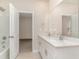 This bathroom features a double sink vanity with white cabinets and a shower and tub combination at 3087 Dover Branch Dr., Little River, SC 29566