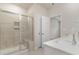 Bathroom features a tiled walk-in shower with a bench and double sinks at 3087 Dover Branch Dr., Little River, SC 29566