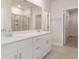 Bathroom features a double vanity, large mirror, and tiled floors at 3087 Dover Branch Dr., Little River, SC 29566