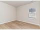 Bedroom with hardwood floors, a large window, and neutral colors at 3087 Dover Branch Dr., Little River, SC 29566