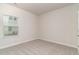 Bedroom with carpeted floors, neutral colors, and a view of the backyard at 3087 Dover Branch Dr., Little River, SC 29566