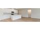 Modern kitchen boasts white cabinets, stainless steel appliances, and a kitchen island at 3087 Dover Branch Dr., Little River, SC 29566