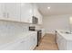 Stylish kitchen featuring white countertops, stainless steel appliances, and elegant tile backsplash at 3087 Dover Branch Dr., Little River, SC 29566