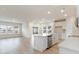 Bright, open-concept kitchen featuring an island with sink and stainless-steel dishwasher at 3087 Dover Branch Dr., Little River, SC 29566