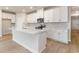 Spacious kitchen island with stainless steel appliances, white cabinets, and marble backsplash at 3087 Dover Branch Dr., Little River, SC 29566