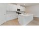 Well-designed kitchen with a central island, white cabinetry, and stainless-steel microwave at 3087 Dover Branch Dr., Little River, SC 29566