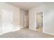 Main bedroom features carpeted floors and an ensuite bathroom at 3087 Dover Branch Dr., Little River, SC 29566
