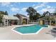 Beautiful in-ground pool with pool house, pergola and landscaped surroundings, creating a private oasis at 316 13Th Ave. N, Surfside Beach, SC 29575