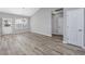 Dining area features wood-look flooring, chandelier, and a rear door to the backyard at 352 Oak Crest Circle, Longs, SC 29568