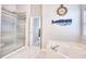 Bright bathroom featuring a tub, and a glass shower, plus coastal decor at 3736 Brookhill Dr., Myrtle Beach, SC 29588