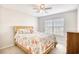 Comfortable bedroom with a wood bed frame and bright natural lighting at 3736 Brookhill Dr., Myrtle Beach, SC 29588