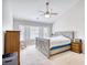 Primary bedroom with vaulted ceiling, ceiling fan, and natural light from the windows at 3736 Brookhill Dr., Myrtle Beach, SC 29588