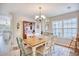 Dining room with a wood table and chairs, chandelier, and hardwood floors at 3736 Brookhill Dr., Myrtle Beach, SC 29588