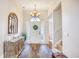 Welcoming foyer with hardwood floors, a decorative mirror, and a statement chandelier at 3736 Brookhill Dr., Myrtle Beach, SC 29588