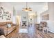 Spacious living room with hardwood floors, ceiling fan, fireplace and neutral paint at 3736 Brookhill Dr., Myrtle Beach, SC 29588