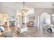 Open-concept living room featuring a vaulted ceiling, fireplace, and hardwood floors at 3736 Brookhill Dr., Myrtle Beach, SC 29588