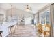 Bright living room with hardwood floors, a ceiling fan, and natural light from the windows at 3736 Brookhill Dr., Myrtle Beach, SC 29588
