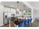 Modern kitchen with stainless steel appliances, center island with seating and pendant lighting at 4043 Bucolic Loop, Myrtle Beach, SC 29588