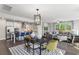 Open-concept space features a modern kitchen, dining area, and comfortable living area at 4043 Bucolic Loop, Myrtle Beach, SC 29588