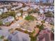 This aerial view showcases a well-manicured property, surrounded by lush greenery, in a quaint neighborhood at 405 Banyan Place, North Myrtle Beach, SC 29582