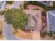 Aerial view of a landscaped property with a well-maintained roof and surrounding greenery at 405 Banyan Place, North Myrtle Beach, SC 29582
