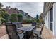 Inviting backyard patio with a large outdoor dining set and well-maintained landscaping at 405 Banyan Place, North Myrtle Beach, SC 29582