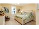 Bedroom featuring beautiful paintings and a comfortable bed at 405 Banyan Place, North Myrtle Beach, SC 29582