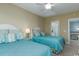 Inviting bedroom featuring two twin beds with turquoise comforters and nautical-themed decor at 405 Banyan Place, North Myrtle Beach, SC 29582