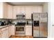 Kitchen featuring stainless steel appliances, granite countertops, and ample cabinet space at 405 Banyan Place, North Myrtle Beach, SC 29582